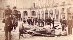 "Communards" pose with the statue of Napoléon I from the toppled Vendôme column